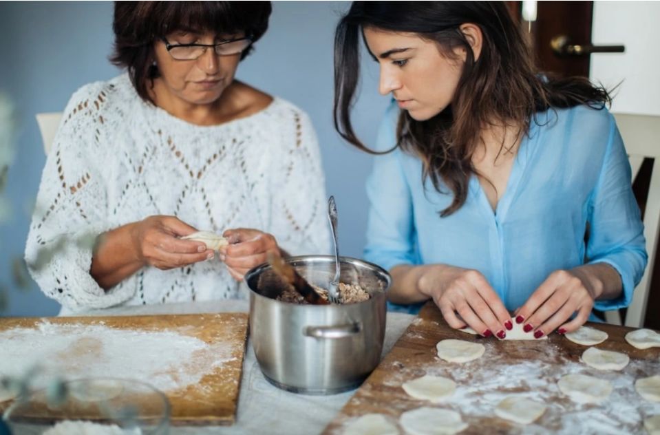 2 women cooking at home photo